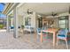 Spacious patio featuring seating and a dining area with a seamless transition to the home interior at 13202 Borrego St, Venice, FL 34293