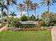 The Islandwalk community entrance features lush landscaping and attractive signage, welcoming residents and guests at 13202 Borrego St, Venice, FL 34293