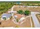 Aerial view of a home with meticulously landscaped grounds, showcasing the roofline and curb appeal at 13648 Clara Ln, Port Charlotte, FL 33981