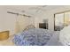 Charming bedroom with a floral bedspread, tile flooring, and ample closet space at 13648 Clara Ln, Port Charlotte, FL 33981