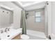 Modern bathroom with a shower/tub combination, modern fixtures and stylish vanity at 140 Hermes Rd, Venice, FL 34293