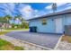 Paver driveway with a side view of the house featuring a well-maintained exterior and landscaping at 140 Hermes Rd, Venice, FL 34293