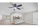 Open floor plan featuring wood floors and a kitchen with stainless steel appliances at 140 Hermes Rd, Venice, FL 34293
