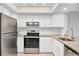 Bright eat-in kitchen features stainless steel appliances and granite countertops at 140 Hermes Rd, Venice, FL 34293