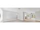 The living room has wood-look floors with an open layout to the kitchen at 140 Hermes Rd, Venice, FL 34293