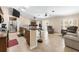 Open kitchen layout with granite countertops, stainless steel appliances, and a breakfast bar at 14124 Kewanee Ln, Port Charlotte, FL 33981