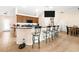 Kitchen featuring a breakfast bar with seating and sleek stainless steel appliances at 14124 Kewanee Ln, Port Charlotte, FL 33981