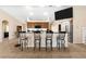 Kitchen featuring a breakfast bar with seating, stainless steel appliances, and tile flooring at 14124 Kewanee Ln, Port Charlotte, FL 33981