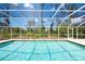 Sparkling pool with a screened enclosure at 14124 Kewanee Ln, Port Charlotte, FL 33981