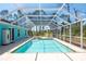 Exterior pool and spa with screened enclosure at 14124 Kewanee Ln, Port Charlotte, FL 33981