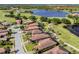Aerial view showcasing the home's location by a lake and golf course at 162 Palazzo Ct, North Venice, FL 34275