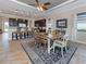 Bright open dining area with breakfast bar into kitchen at 162 Palazzo Ct, North Venice, FL 34275