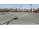 Outdoor tennis court surrounded by landscaping and lighting at 162 Palazzo Ct, North Venice, FL 34275