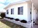 Home with a well-maintained yard and brick accents, showcasing the home's curb appeal at 175 Palm Harbor Dr, North Port, FL 34287