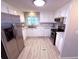 Bright kitchen features modern stainless steel appliances, granite counters, and sleek cabinetry at 175 Palm Harbor Dr, North Port, FL 34287
