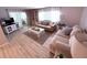 Inviting living room with stylish sofas, a glass-top coffee table, and neutral decor offers a comfortable gathering space at 175 Palm Harbor Dr, North Port, FL 34287