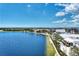 Aerial community view showing lakefront, boardwalk, building exteriors and street layouts in Wellen Park at 17515 Jadestone Ct, Venice, FL 34293