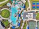 Drone shot of community recreational area showcasing pool, pickleball and tennis courts, and clubhouse amenities at 17515 Jadestone Ct, Venice, FL 34293