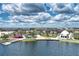 Aerial view of Wellen Park with waterfront views, community buildings and amenities under a partly cloudy sky at 17515 Jadestone Ct, Venice, FL 34293