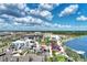 Community aerial view of Wellen Park, showcasing amenities, lake, green spaces, and parking at 17515 Jadestone Ct, Venice, FL 34293