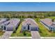 Beautiful aerial view of the home, showing roof, landscaping, driveway, and proximity to other homes at 17515 Jadestone Ct, Venice, FL 34293
