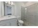 Bathroom with a single sink vanity and glass enclosed shower with a built-in seat at 17515 Jadestone Ct, Venice, FL 34293