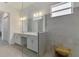 Modern bathroom featuring a large glass shower and a double vanity at 17515 Jadestone Ct, Venice, FL 34293