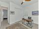 Bedroom offers wood-look tile floors, a ceiling fan, and a closet with bi-fold doors at 17515 Jadestone Ct, Venice, FL 34293