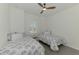 Bright bedroom featuring two twin beds with blue and white patterned linens at 17515 Jadestone Ct, Venice, FL 34293