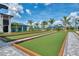 Enjoy outdoor recreation on the community's pristine bocce ball courts, surrounded by lush landscaping at 17515 Jadestone Ct, Venice, FL 34293