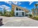 A modern community center with large windows, ample gathering spaces, and contemporary architecture at 17515 Jadestone Ct, Venice, FL 34293