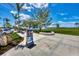 A community entrance with modern signage, manicured landscaping, and an inviting atmosphere at 17515 Jadestone Ct, Venice, FL 34293