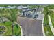 Aerial view of a community entrance featuring modern architecture, manicured landscaping, and a smooth, paved road at 17515 Jadestone Ct, Venice, FL 34293