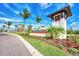 A well-manicured entrance to Wellen Park Golf and Country Club featuring lush landscaping and a stylish welcome sign at 17515 Jadestone Ct, Venice, FL 34293