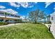 Stunning lawn area with lovely views of the water and building at 17515 Jadestone Ct, Venice, FL 34293