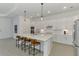 Well-designed kitchen offers a large island, modern appliances, and plenty of counter space at 17515 Jadestone Ct, Venice, FL 34293