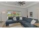 Comfortable living room featuring a sectional sofa and access to the outdoor living area at 17515 Jadestone Ct, Venice, FL 34293