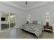 Main bedroom with sliding door to patio area and bright, natural light at 17515 Jadestone Ct, Venice, FL 34293