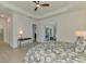 Spacious main bedroom with access to bathroom, patio and entryway at 17515 Jadestone Ct, Venice, FL 34293