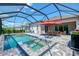 Enjoy the pool, spa, and lanai, perfect for outdoor entertaining in a private setting at 17515 Jadestone Ct, Venice, FL 34293