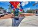 Modern town square featuring colorful shade structures, digital information kiosk, and brick-paved walkways at 17515 Jadestone Ct, Venice, FL 34293