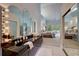 This bathroom boasts multiple mirrors with vanity lighting and a doorway that leads into the bedroom at 181 S Auburn Rd, Venice, FL 34292