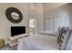 This bedroom has twin beds with decorative pillows, an ensuite bathroom, and access to other areas of the home at 181 S Auburn Rd, Venice, FL 34292