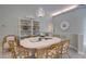 Cozy dining area with stylish table, wicker chairs, and natural light at 181 S Auburn Rd, Venice, FL 34292