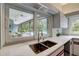 Stainless sink overlooking outdoor living spaces at 181 S Auburn Rd, Venice, FL 34292