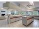 Open kitchen area with central island, integrated appliances, and views of living space at 181 S Auburn Rd, Venice, FL 34292