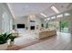 Spacious living room features a fireplace, tile floors, and lots of natural light at 181 S Auburn Rd, Venice, FL 34292