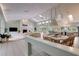 Open concept living and dining area with views of the modern kitchen at 181 S Auburn Rd, Venice, FL 34292