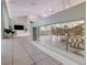 Open concept living space featuring high ceilings and several large windows at 181 S Auburn Rd, Venice, FL 34292
