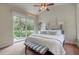 This main bedroom provides easy access to the pool area through a large sliding glass door at 181 S Auburn Rd, Venice, FL 34292